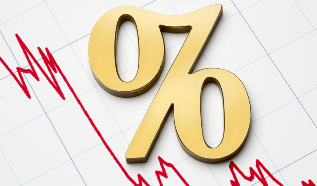 Falling interest rates, large gold percent sign above a white graph with a red line showing decreasing rates