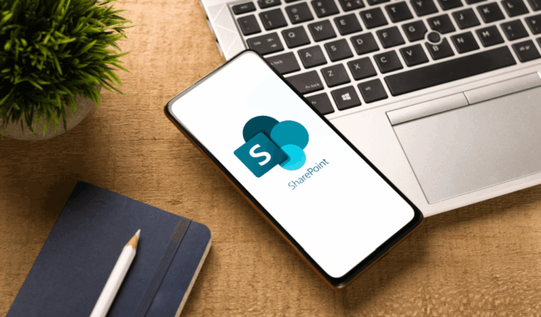 Sharepoint app on a smart phone on top of a laptop